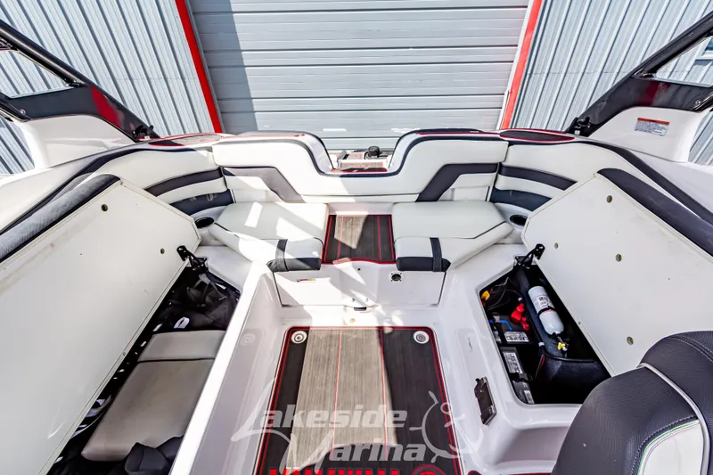 Slide: The Image of 2016 Yamaha Boats 242 Limited S E-Series interior with seating and storage compartments. - 18