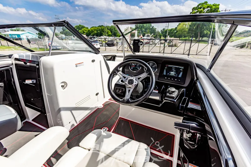 Slide: The Image of 2016 Yamaha Boats 242 Limited S E-Series cockpit with modern controls and steering wheel. - 22