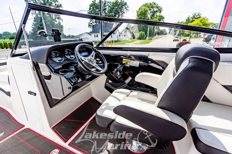 Slide: The Image of Interior view of 2016 Yamaha Boats 242 Limited S E-Series, featuring sleek dashboard and seating. - 23