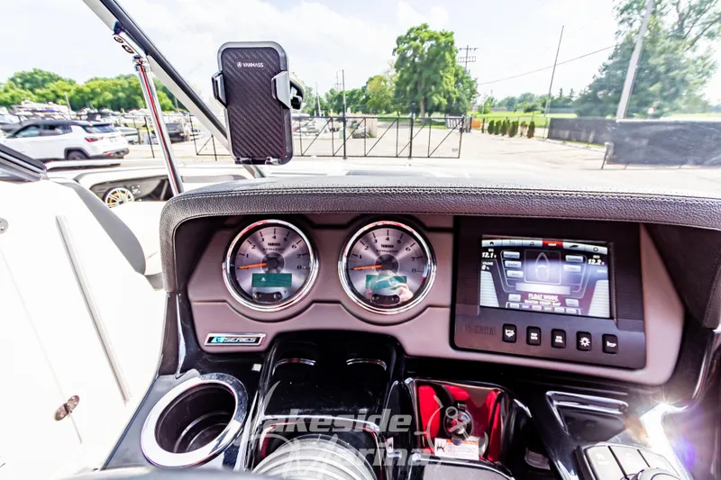 Slide: The Image of Dashboard of 2016 Yamaha Boats 242 Limited S E-Series with gauges and touchscreen display. - 25
