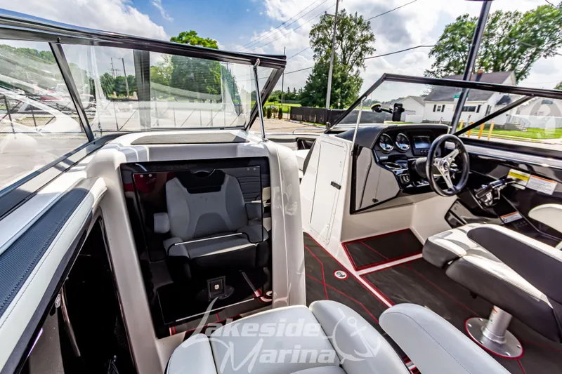 Slide: The Image of 2016 Yamaha Boats 242 Limited S E-Series interior with modern dashboard and seating. - 29