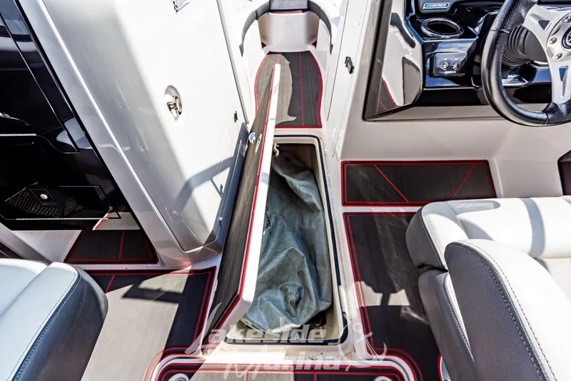 Slide: The Image of 2016 Yamaha Boats 242 Limited S E-Series interior with open storage compartment. - 32