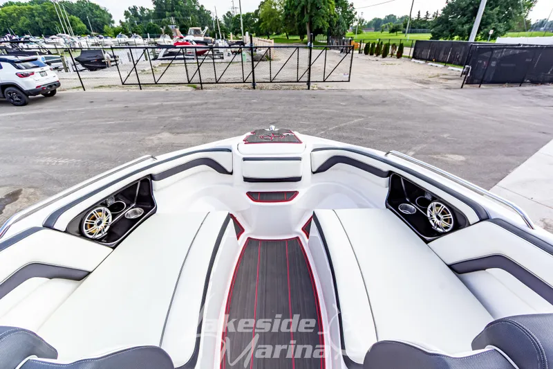 Slide: The Image of 2016 Yamaha Boats 242 Limited S E-Series interior with sleek seating and speakers. - 36