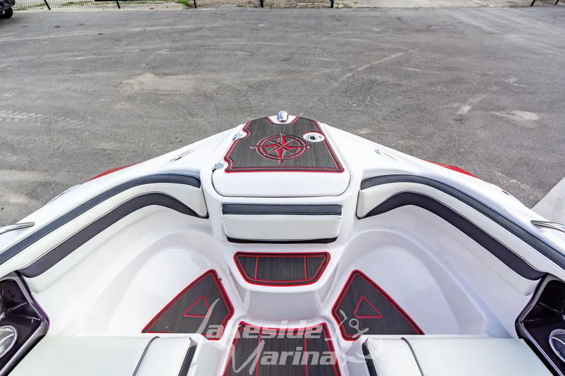 Slide: The Image of 2016 Yamaha Boats 242 Limited S E-Series bow seating area with stylish design and compass detail. - 37