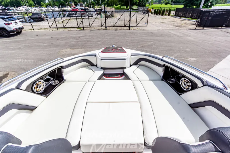 Slide: The Image of 2016 Yamaha Boats 242 Limited S E-Series interior with plush seating and speakers. - 38