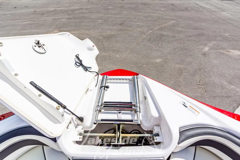 Slide: The Image of 2016 Yamaha Boats 242 Limited S E-Series with open storage compartment and ladder. - 41