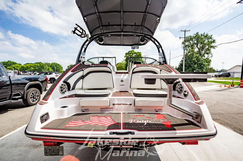 Slide: The Image of 2016 Yamaha Boats 242 Limited S E-Series, rear view, showcasing seating and swim platform. - 5