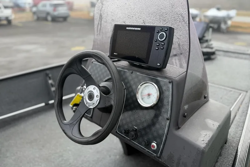 Slide: The Image of 2022 Bass Tracker Classic XL boat dashboard with steering wheel and Humminbird fish finder. - 8