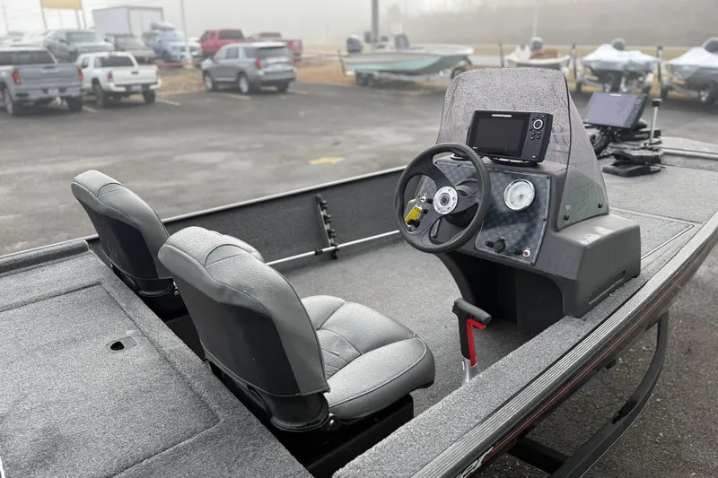 Slide: The Image of 2022 Bass Tracker Classic XL boat interior with steering console and seating. - 9