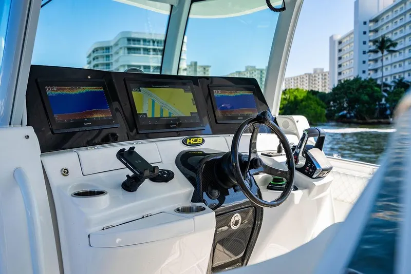 Slide: The Image of Helm of 2024 HCB 42 Lujo boat with advanced navigation displays. - 33
