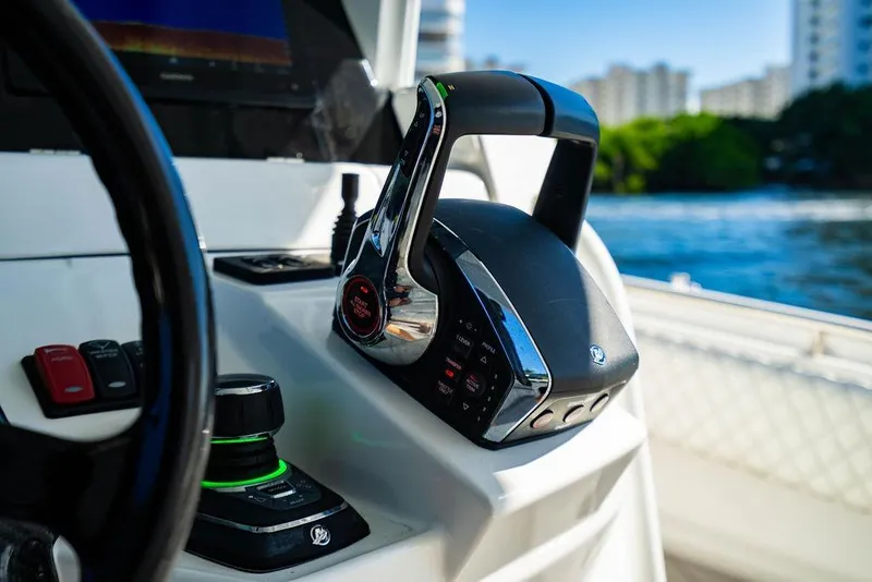 Slide: The Image of Control panel of 2024 HCB 42 Lujo boat with throttle and navigation controls. - 37