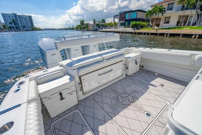 Slide: The Image of Luxurious 2024 HCB 42 Lujo boat interior with elegant seating and scenic waterfront view. - 45