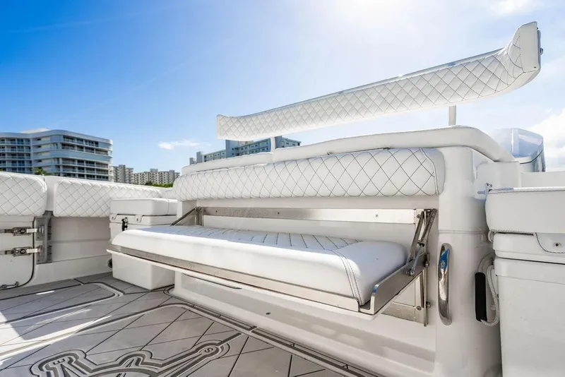 Slide: The Image of 2024 HCB 42 Lujo boat interior with luxurious white seating and modern design. - 47