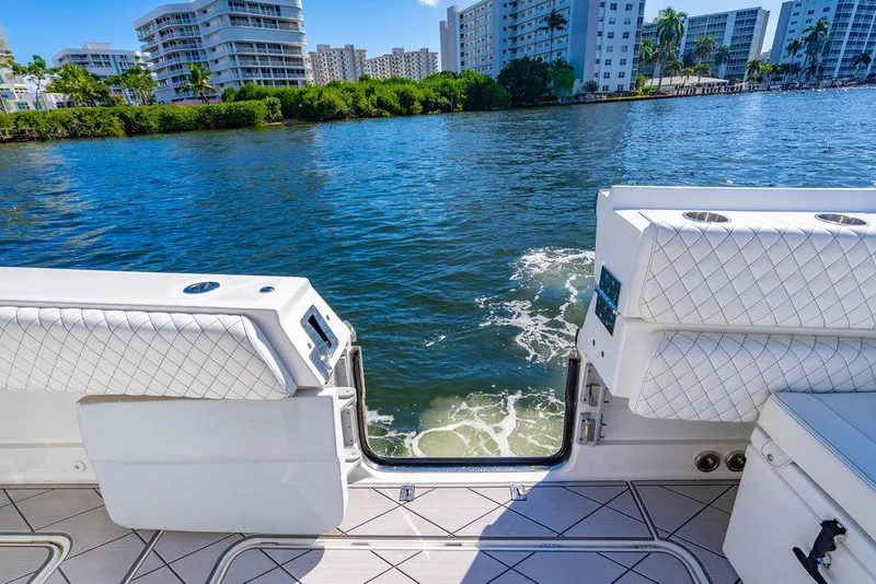 Slide: The Image of 2024 HCB 42 Lujo boat interior with waterfront view, featuring luxurious seating and modern design. - 49