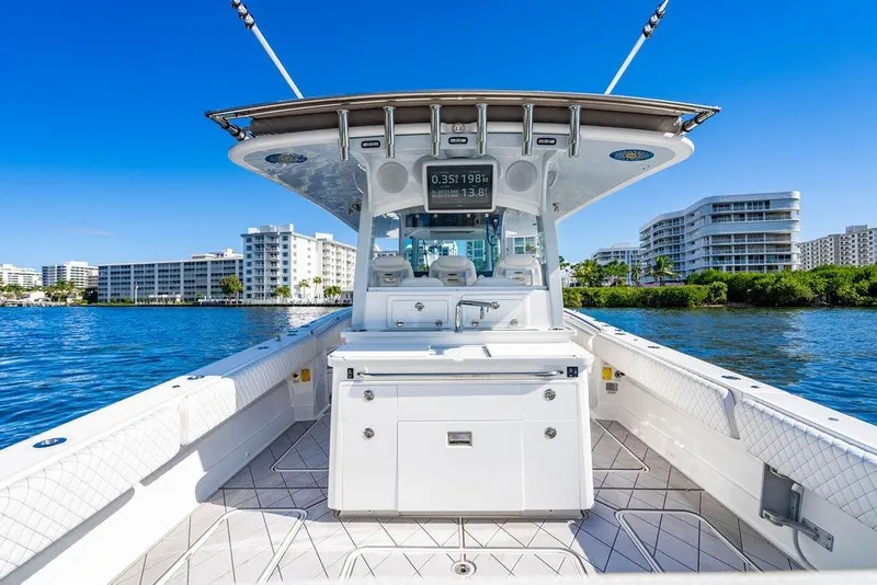 Slide: The Image of 2024 HCB 42 Lujo boat on water, modern design, cityscape background. - 52