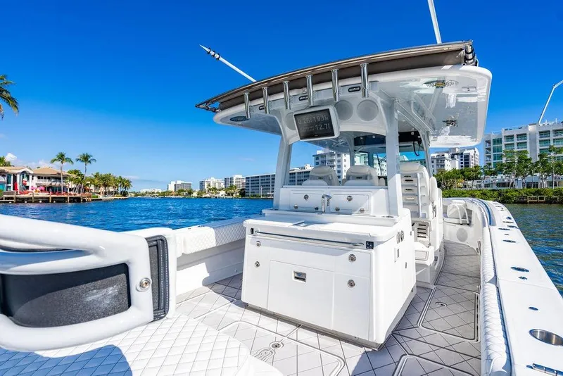 Slide: The Image of 2024 HCB 42 Lujo boat on a sunny waterfront, showcasing luxury design and modern amenities. - 53