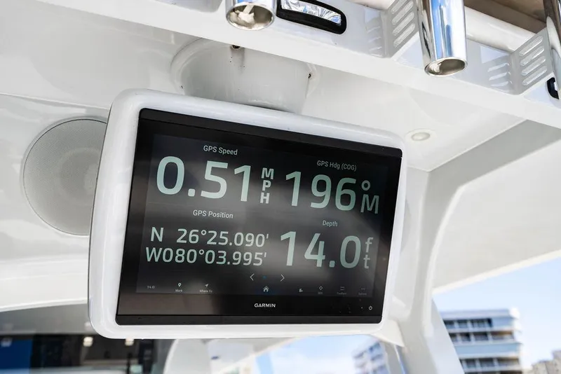 Slide: The Image of 2024 HCB 42 Lujo boat GPS display showing speed, heading, and depth. - 54