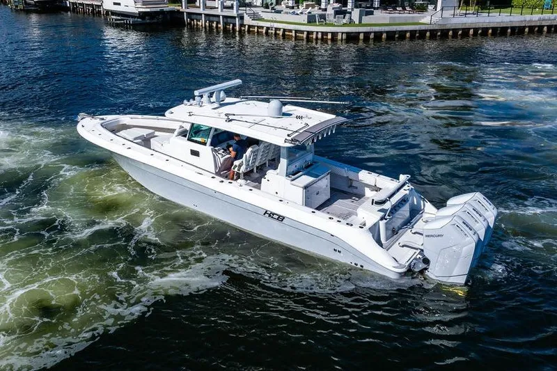 Slide: The Image of 2024 HCB 42 Lujo boat cruising on water with powerful engines. - 6