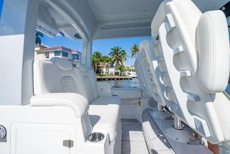 Slide: The Image of Luxurious interior of 2024 HCB 42 Lujo boat with white seating and waterfront view. - 69