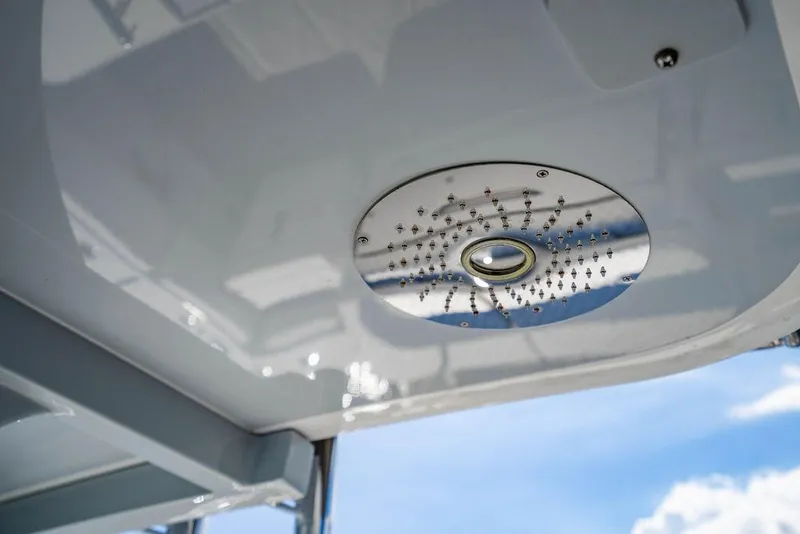 Slide: The Image of 2024 HCB 42 Lujo boat ceiling with modern light fixture, showcasing sleek design. - 74