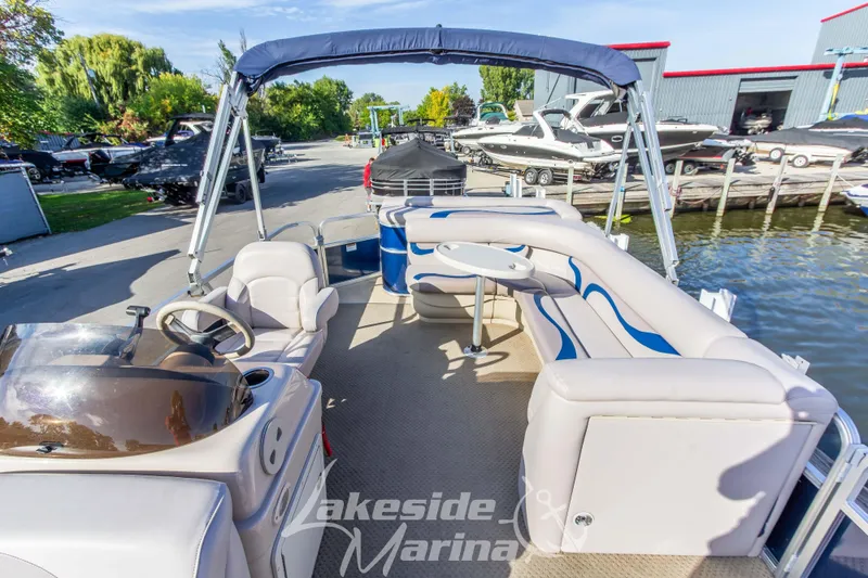 Slide: The Image of 2013 SunChaser DS22 pontoon boat with seating, steering console, and canopy at Lakeside Marina. - 12