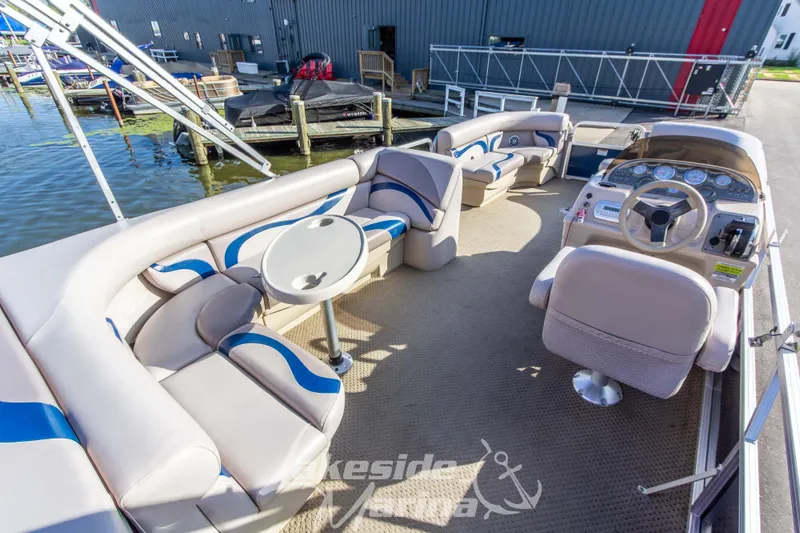 Slide: The Image of Interior of 2013 SunChaser DS22 pontoon boat with seating and steering console. - 21
