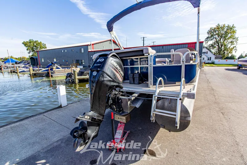 Slide: The Image of 2013 SunChaser DS22 pontoon boat with Mercury 50 HP engine at marina dock. - 6