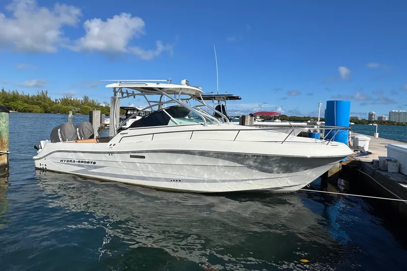 The Image of 2011 Hydra-Sports 3000 VX boat docked at marina under clear blue sky. - 0