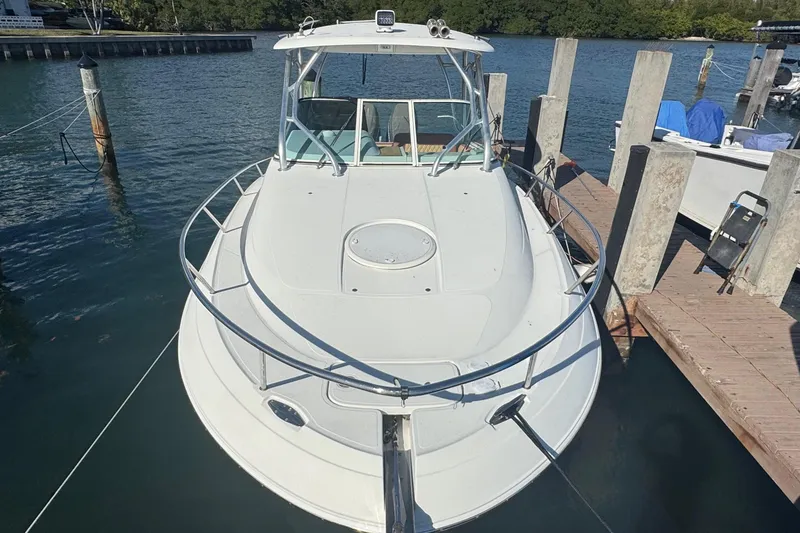 Slide: The Image of 2011 Hydra-Sports 3000 VX boat docked at marina, front view. - 2