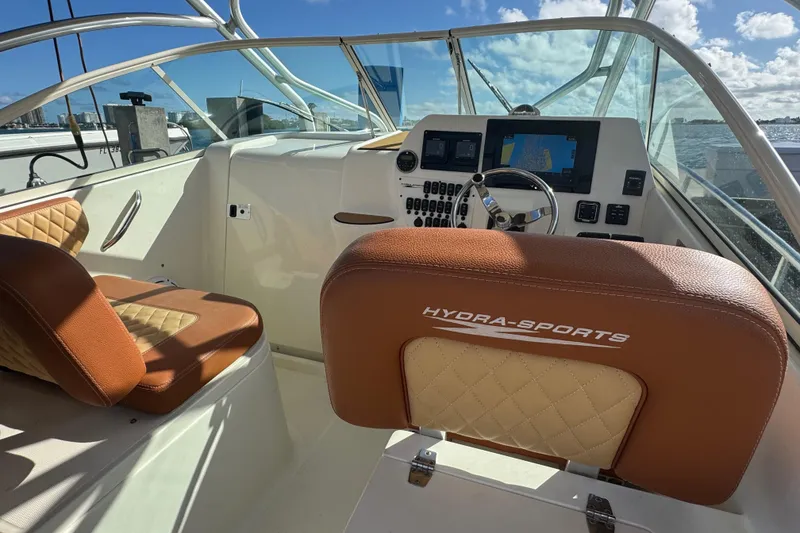 Slide: The Image of 2011 Hydra-Sports 3000 VX boat interior with leather seating and navigation controls. - 21