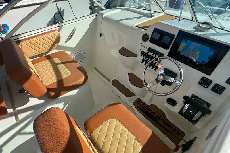 Slide: The Image of 2011 Hydra-Sports 3000 VX boat interior with tan leather seats and modern dashboard. - 22