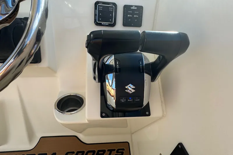Slide: The Image of 2011 Hydra-Sports 3000 VX boat controls with Suzuki throttle and steering wheel. - 26