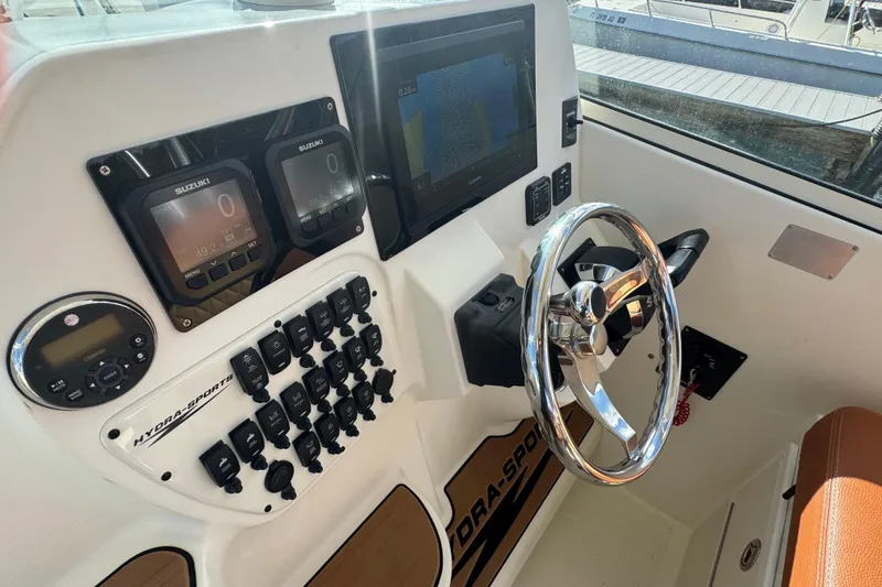 Slide: The Image of 2011 Hydra-Sports 3000 VX boat dashboard with steering wheel and electronic controls. - 31