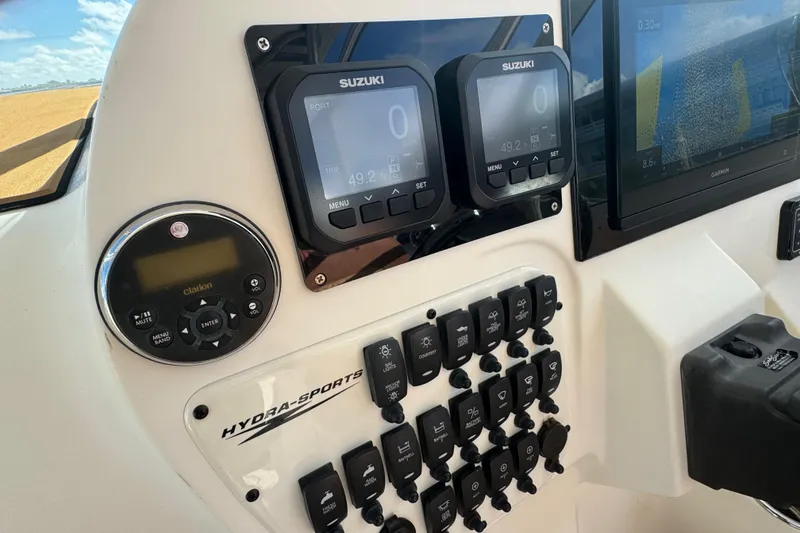 Slide: The Image of 2011 Hydra-Sports 3000 VX dashboard with Suzuki displays and control panel. - 32