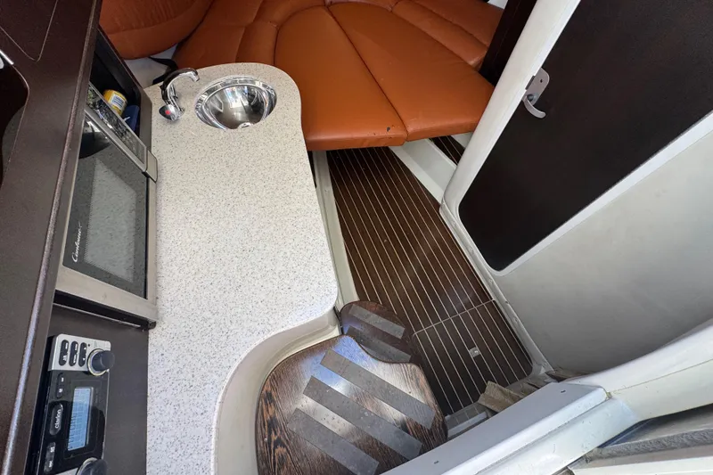 Slide: The Image of 2011 Hydra-Sports 3000 VX cabin interior with kitchenette and seating area. - 37