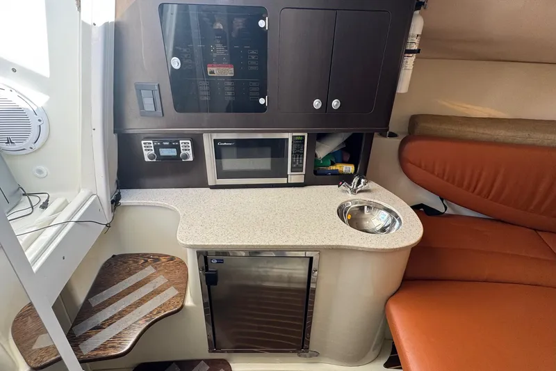 Slide: The Image of 2011 Hydra-Sports 3000 VX cabin interior with kitchenette, microwave, and seating area. - 39