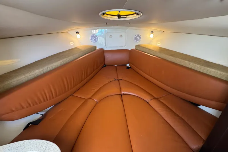 Slide: The Image of 2011 Hydra-Sports 3000 VX cabin interior with brown leather seating and ambient lighting. - 42