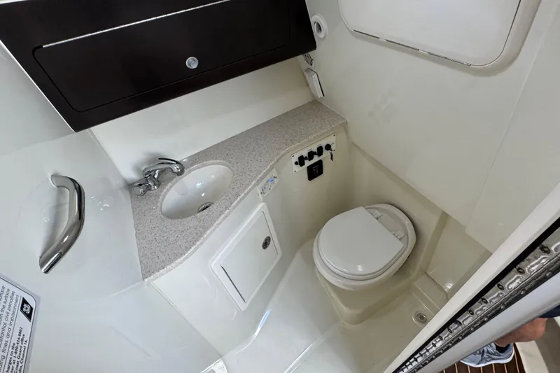 Slide: The Image of 2011 Hydra-Sports 3000 VX boat bathroom with sink and toilet. - 45