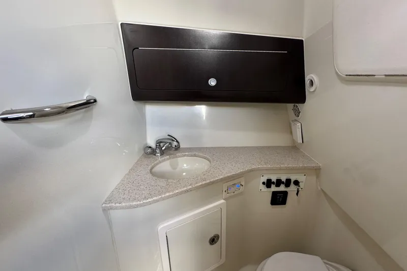 Slide: The Image of 2011 Hydra-Sports 3000 VX boat bathroom with sink, cabinet, and controls. - 47