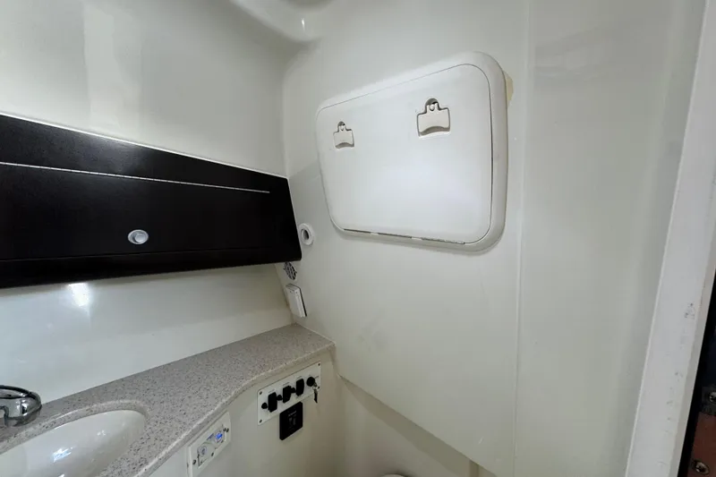 Slide: The Image of 2011 Hydra-Sports 3000 VX interior cabin with storage and sink. - 48