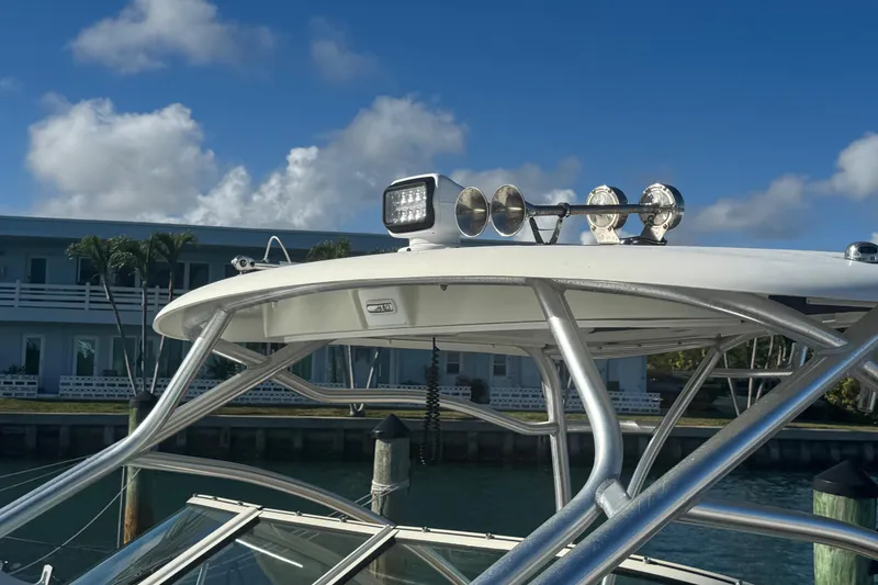 Slide: The Image of 2011 Hydra-Sports 3000 VX boat with radar and lights, docked under a clear blue sky. - 5
