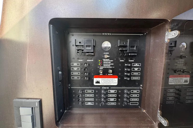 Slide: The Image of Electrical control panel on a 2011 Hydra-Sports 3000 VX boat, featuring various switches and indicators. - 50