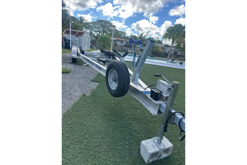 Slide: The Image of Trailer for 2011 Hydra-Sports 3000 VX boat on grass, under a cloudy sky. - 55