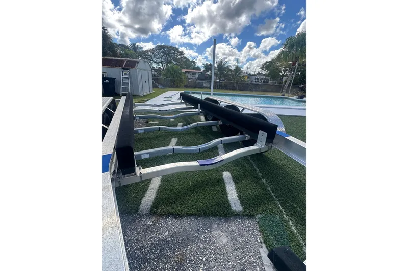 Slide: The Image of Boat trailer on grass, under a cloudy sky, for 2011 Hydra-Sports 3000 VX. - 58