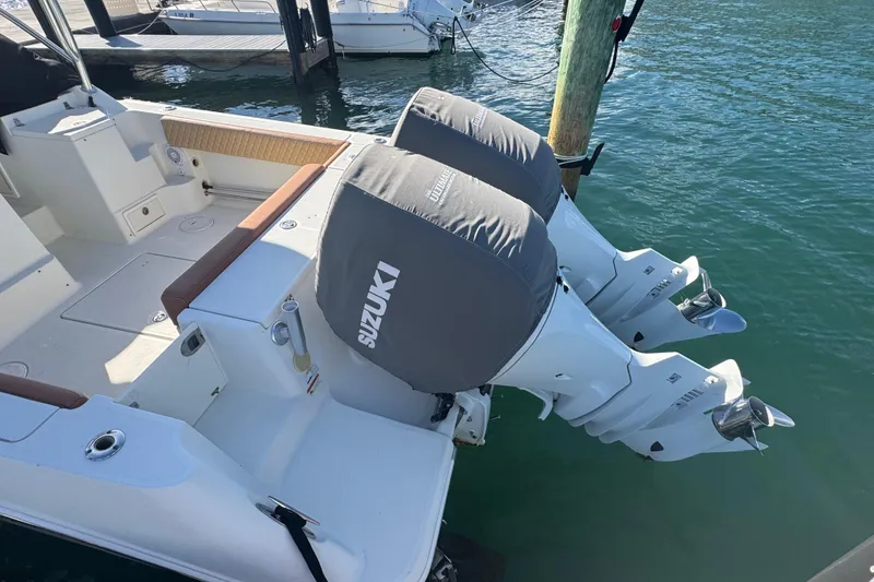 Slide: The Image of 2011 Hydra-Sports 3000 VX boat with dual Suzuki outboard motors at dock. - 8