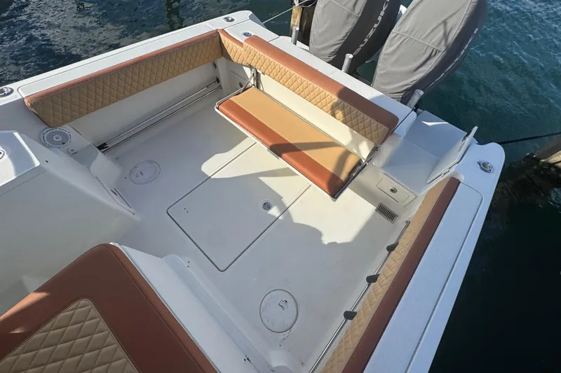 Slide: The Image of 2011 Hydra-Sports 3000 VX boat interior with cushioned seating and storage compartments. - 9