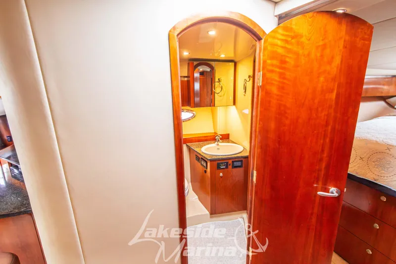 Slide: The Image of Luxurious 2006 Cruisers Yachts 420 Express interior with elegant wood finish and modern amenities. - 102