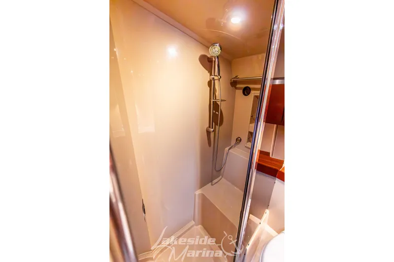 Slide: The Image of 2006 Cruisers Yachts 420 Express bathroom with modern shower and sleek design. - 109