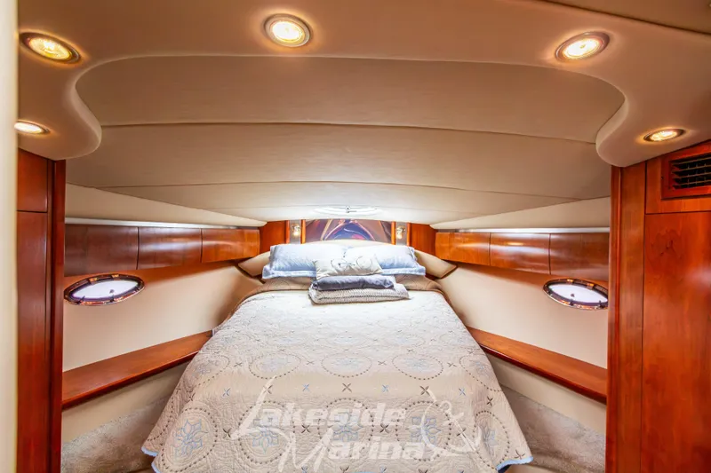 Slide: The Image of Luxurious cabin interior of 2006 Cruisers Yachts 420 Express with elegant wood finish. - 112