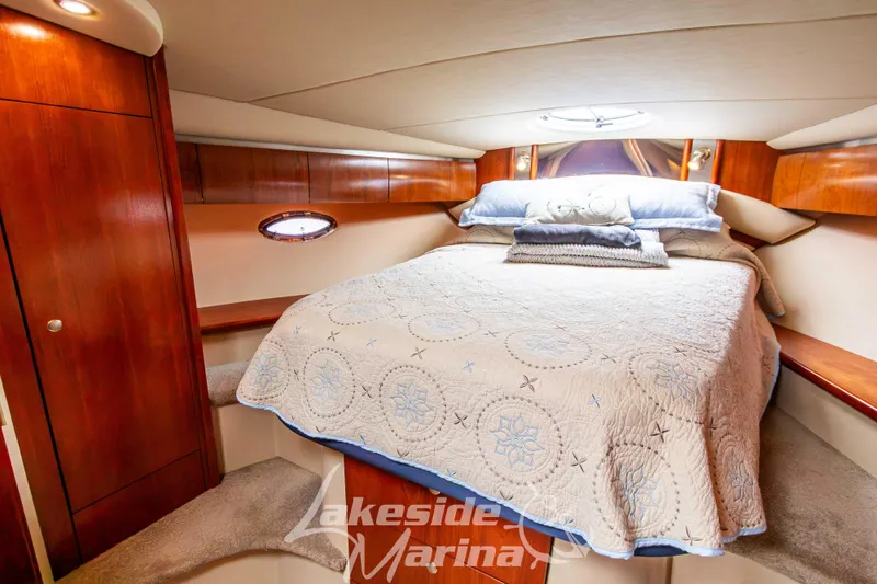 Slide: The Image of Luxurious cabin interior of 2006 Cruisers Yachts 420 Express with cozy bedding. - 113